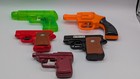 Lot Of 4 Vintage 70s   80s Plastic Water Squirt Guns   1 Vintage Cap Gun