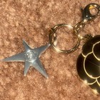 Chanel Holiday 2025 Camellia Flower Gold Charm W  Small Comet Charm W cc Logo
