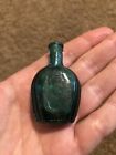 Small Green Glass Bottle Benjamin Franklin Embossed 2  Tall Vintage Taiwan