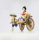 Vintage Asian Woman   Boy Pulling Cart Occupied Japan Celluloid plastic Fuji