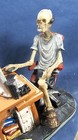Skeleton At The Computer Desk With Headphones Figurine