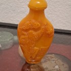 Chinese Orange Carved Snuff Bottle W  Figural Relief   Stopper