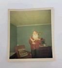 Vintage Photo Person Holding Santa Claus Mask With Christmas Presents  1968 