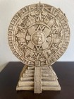 Aztec Mythology Inspired Statue With Aztec Sun Stone And A Stepped Pyramid Base