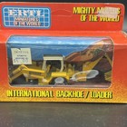 Ertl 1 64 Mighty Movers Of The World International Backhoe Loader
