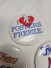 9 Vintage Fosters Freeze Promotional Pin Buttons Badges Various 