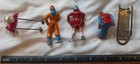 Lot Of 4 Skiers  Skaters   Sledding Hand Painted Lead Figures  Barclay