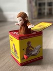 Schylling Curious George Jack-in-the-box Tin Musical Toy