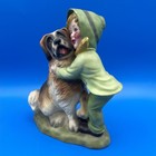 Vintage Figurine Of A Girl Hugging Her Saint Bernard Dog
