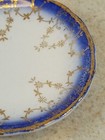 Antique New Wharf Pottery Trilby Flow Blue Butter Pat 3 1 4  Gold Trimmed 