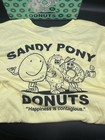 Pluribus - Sandy Pony Donuts Pluribus Cream Tee Large   Donut Box - Official 