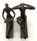 Danya B Set Of 2 Metal Art Sculpture Bookends Man   Woman Stretched Out Reading
