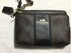 Coach Corner Zip Wristlet In Canvas leather Signature