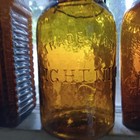 Heavily Whittled Pretty Amber Lightning Putnam Fruit Jar Original Closure   Lid