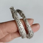 A Pair Old Chinese Tibet Silver Handcarved Riches And Honour Bracelets