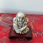 Japanese 2    Netsuke-style Carved Seated Figure Incised Decoration 2 Holes W std
