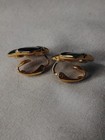 Sarah Coventry Black Enamel Gold Tone Ribbon Knot Clip On Earrings Vintage