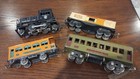 Lot Of 4 Lionel Train Items  1 Tugger Engine   1 Box Car  2 Passenger Cars