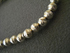Italian Sterling Silver Chased Bead Strung On Nylon Stretch Bracelet