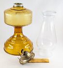 P   A Risdon Oil Lamp  Amber Glass With Ivy Pattern Foot