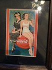 Two Collectible Framed Coca Cola Art