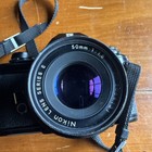Nikon Em 35mm Slr Film Camera With  Two 50 Mm Lenses