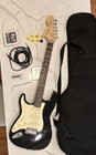 Squier By Fender Stratocaster Electric Guitar Black W gig Bag  Cable picks tuner