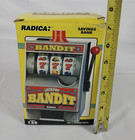 Radica Jackpot Bandit Slot Machine Bank Model 130     1990s Vintage Coin Bank