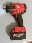 Milwaukee M18 Heavy Duty Impact Wrench Red black W  5 0ah Redlithium Battery