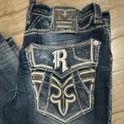 Rock Revival Slim Tapered Blue Denim Jeans Embroidered Logo Button Accents Men s