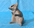 Retired Hagen Renaker Raccoon Sitting Paw Out