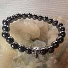 Hematite Beaded Bracelet With Skull Charm  Stretchable  Black Stone  Unisex