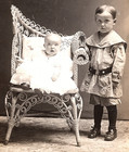 Antique Vintage Real Photo Postcard Child And Baby In Ornate Wicker Chair