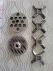  22 Meat Grinder Plates 2 Total     Knives 4 Total  In Excellent Condition