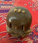 Japanese Carved Netsuke Figurine Child Holding Fish W  Cord Holes  himotoshi 