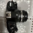 Nikon Em Black 35mm Slr Film Camera W  Series E 50mm F 1 8 Lens  Cap