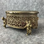 Vintage Cherub Legged Trinket Jewelry Box Gold Tone Brass Oval Shaped Ornate