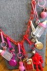Vtg 1980s Charm Necklace 10 Charms Clip Bell Charms Red Chain Pink Plastic