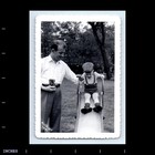 Old Vintage Photo Man Holding Camera Boy On Playground Slide 1951 Snapshot