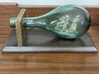 Vintage Folk Art Ship In Green Glass Bottle  Mounted On A Wood Base 