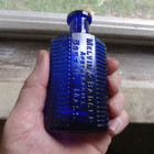 Melvin   Badger Boston 2 Oz Cobalt Irregular Hexagon Poison Bottle 4 1 2 tall