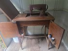 Antique Pre-1930 Sewing Machine In Brown Wooden Cabinet