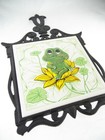 11 75  Sears Roebuck Japan Vintage 1970s Neil The Frog Tile Cast Iron Trivet
