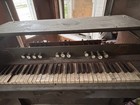 Antique Pump Organ With Foot Pedals And Decorative Cherub Motif