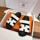 Beautiful Woman Wearing Brand New White Hermes Slippers