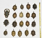 Lot Of 19 Cast African Pendants In Form Of Masks