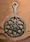 Vintage Black Cast Iron Footed Trivet  Jzh P Circle Of Rings Flower 6   x9    1948
