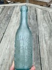 Aqua Applied Blob Top Embossed Bottle H Bruauninger 2220 N 4th St Philadadelphia