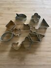 Lot 12 Antique Metal Cookie Cutters In Round Metal Tin