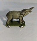 German Tin Litho Elephant Pull Penny Toy On Green Stand Rare 
